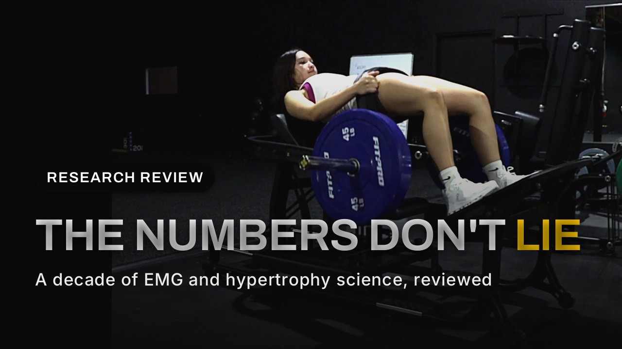Woman performing a hip thrust on the GluteZone Hip Thrust Machine in a dark commercial gym