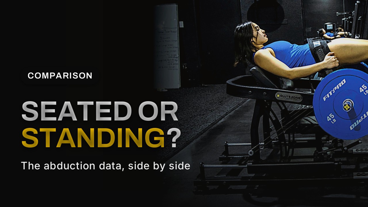 Woman training glutes on a commercial hip thrust machine in a dark gym, comparison of seated vs standing abduction