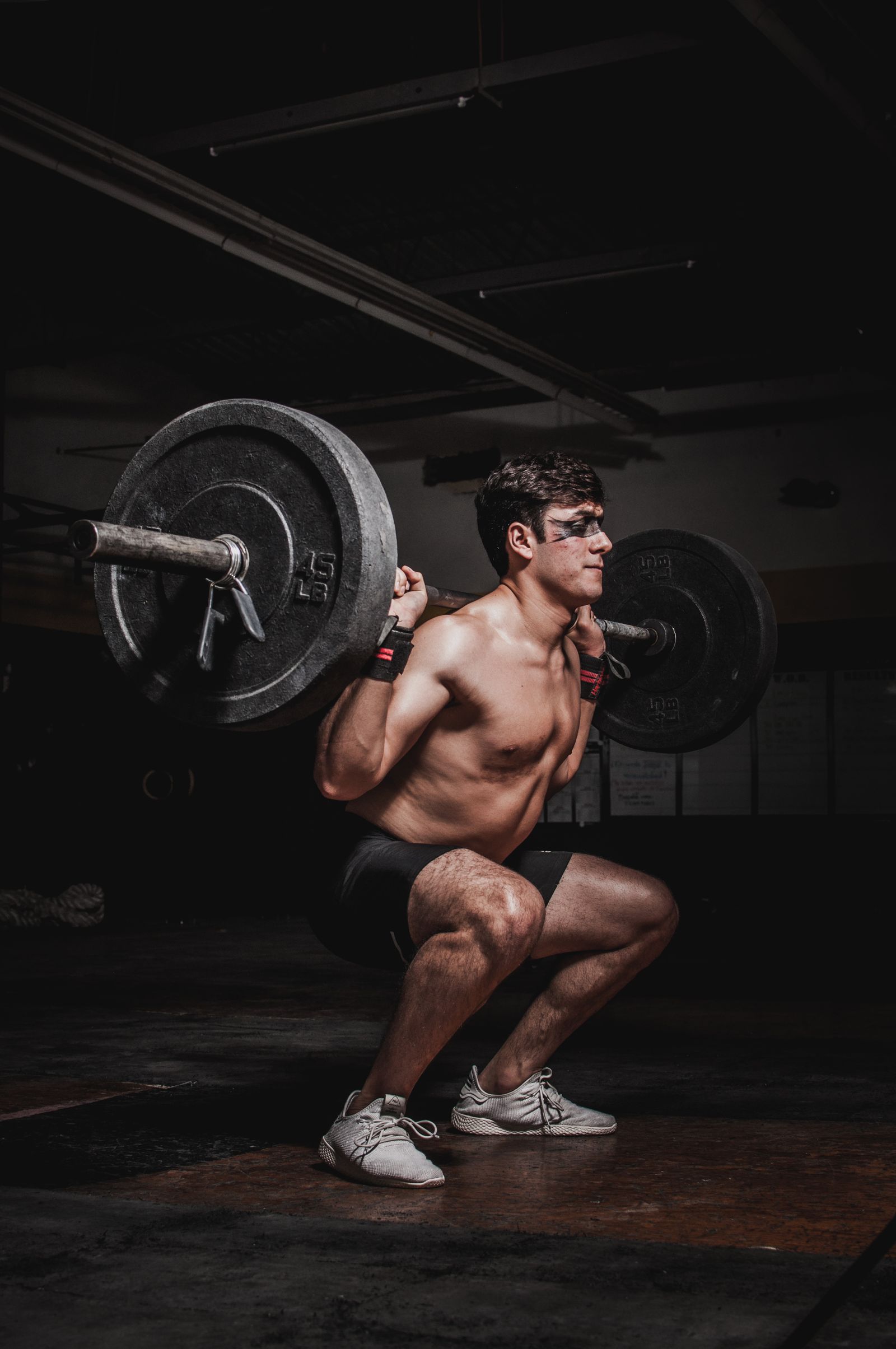 The Loaded Stretch: Why Deep Hip Extension Builds Bigger Glutes 2 Athlete in a deep barbell back squat, loading the glutes at long muscle length